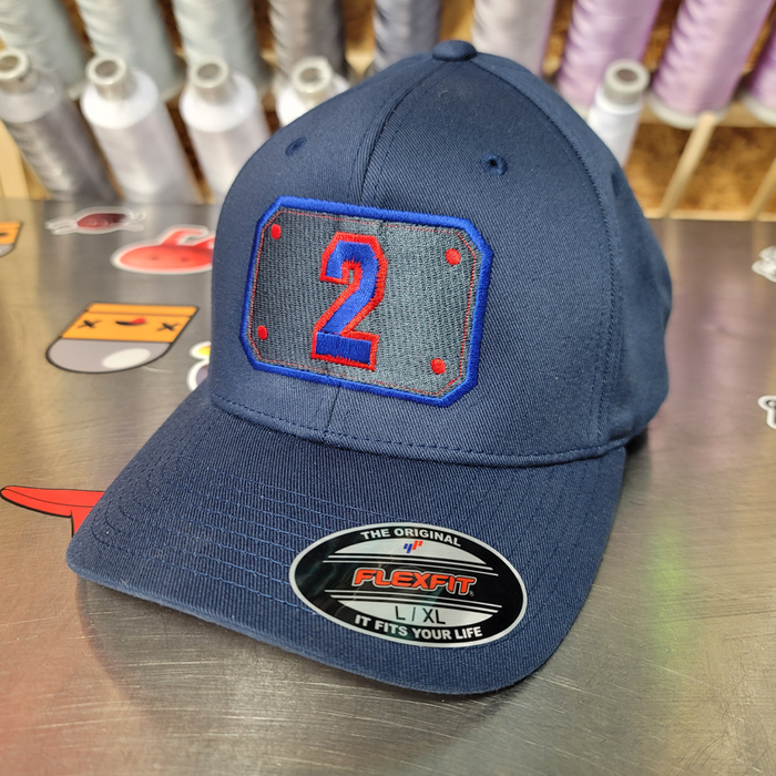 ONE-OFF Passport with Number 2 Hat- Flexfit Navy with Red/Blue